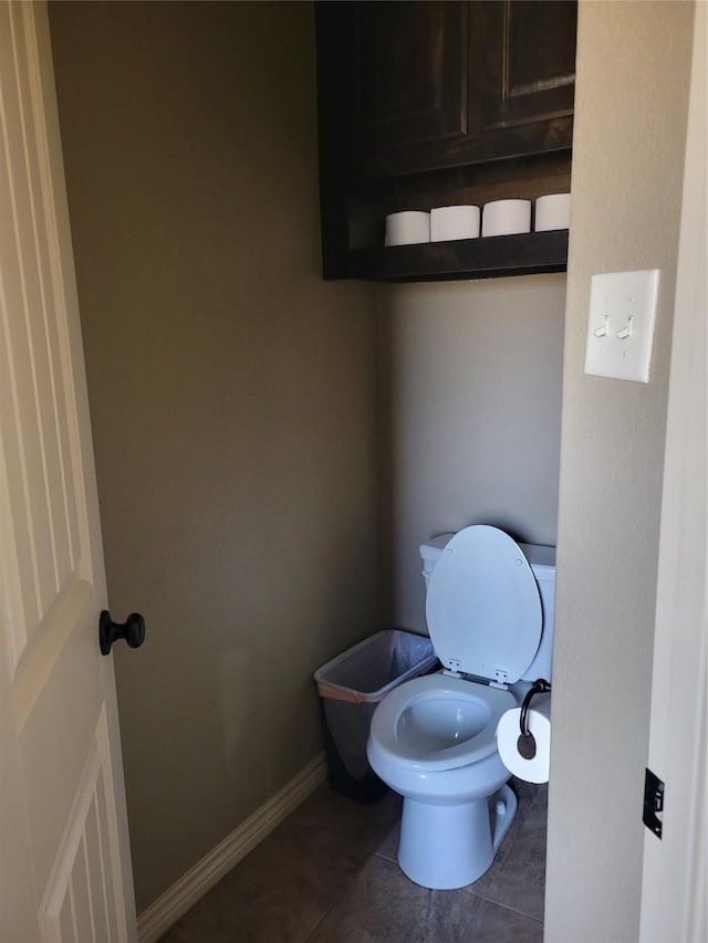 bathroom featuring tile patterned floors and toilet