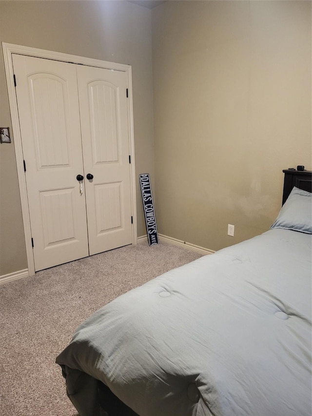 carpeted bedroom with a closet