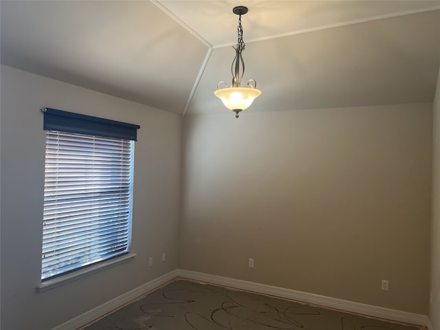 unfurnished room with vaulted ceiling and baseboards