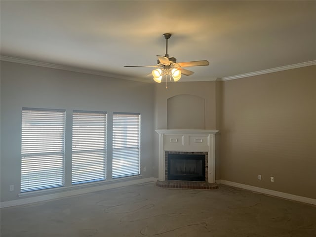 unfurnished living room featuring ornamental molding, a brick fireplace, baseboards, and a ceiling fan