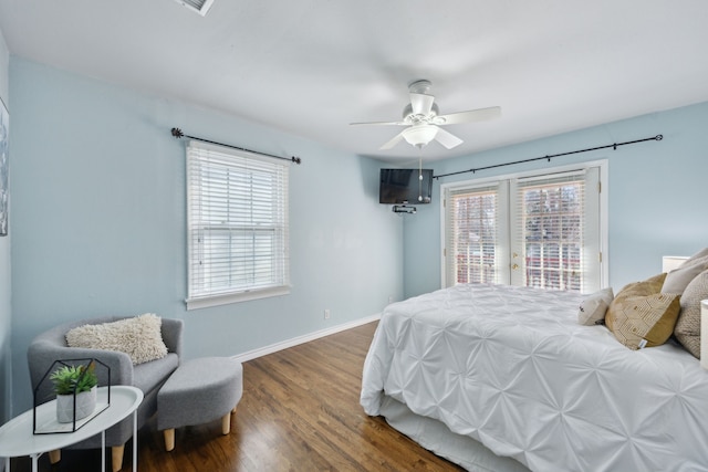 bedroom with dark wood-type flooring, ceiling fan, and access to outside