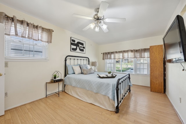 bedroom featuring ceiling fan and light hardwood / wood-style floors