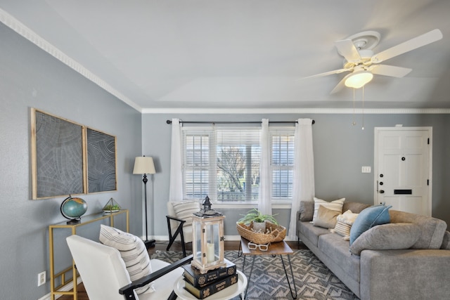 living room featuring hardwood / wood-style flooring, ceiling fan, and ornamental molding