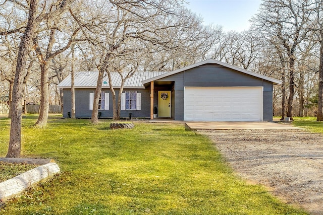 ranch-style home with a garage and a front yard