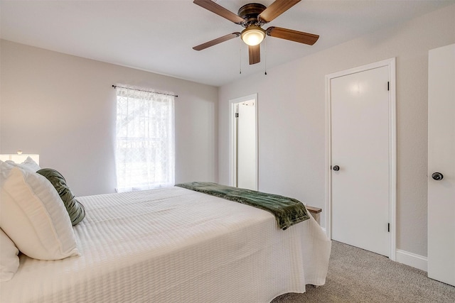 carpeted bedroom featuring ceiling fan