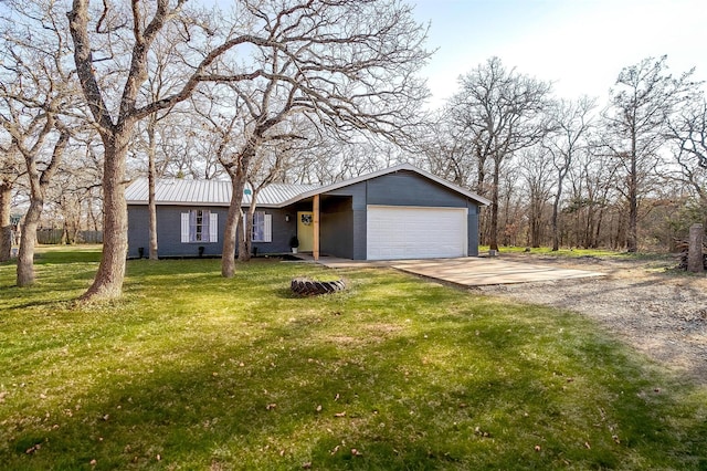 ranch-style home featuring a garage and a front lawn