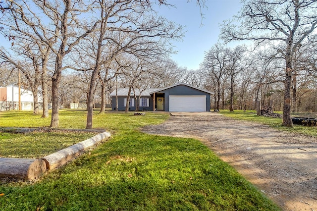 view of front facade with a garage and a front lawn