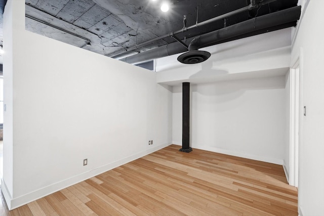 basement featuring hardwood / wood-style flooring