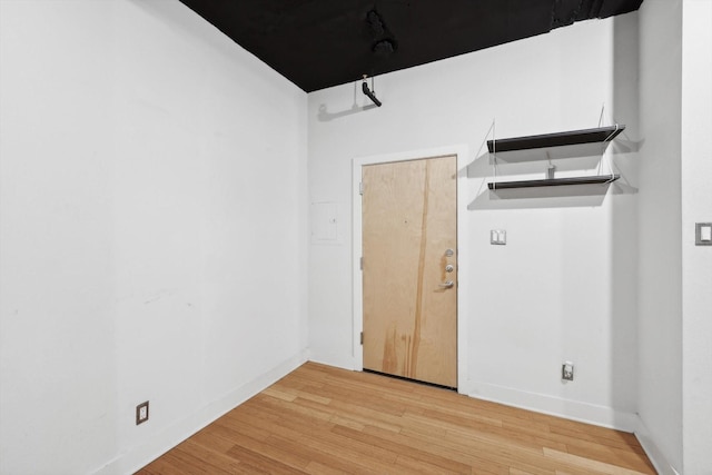 empty room with light hardwood / wood-style floors