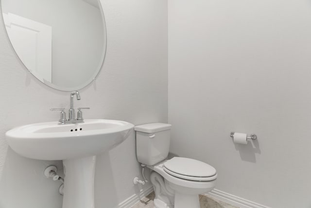 bathroom featuring sink and toilet