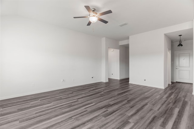 empty room featuring dark hardwood / wood-style flooring and ceiling fan