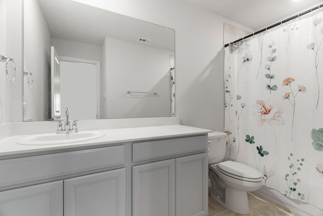 bathroom with tile patterned flooring, vanity, a shower with shower curtain, and toilet