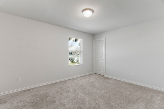 empty room with light colored carpet