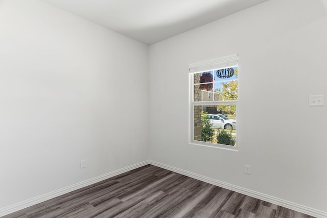 unfurnished room featuring dark hardwood / wood-style flooring