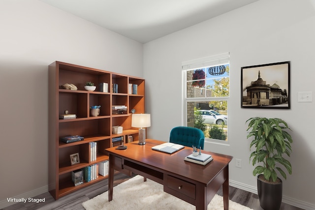 home office with hardwood / wood-style flooring