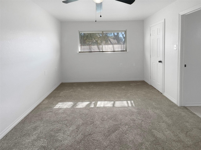 empty room with carpet floors and ceiling fan