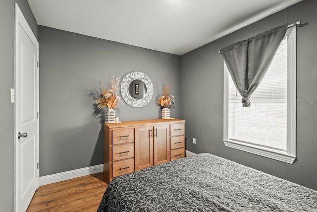 bedroom featuring dark hardwood / wood-style flooring