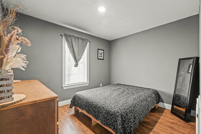 bedroom with hardwood / wood-style flooring