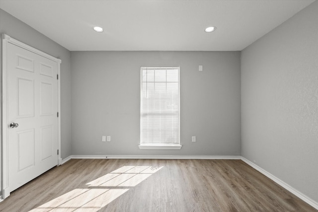 empty room with light wood-type flooring