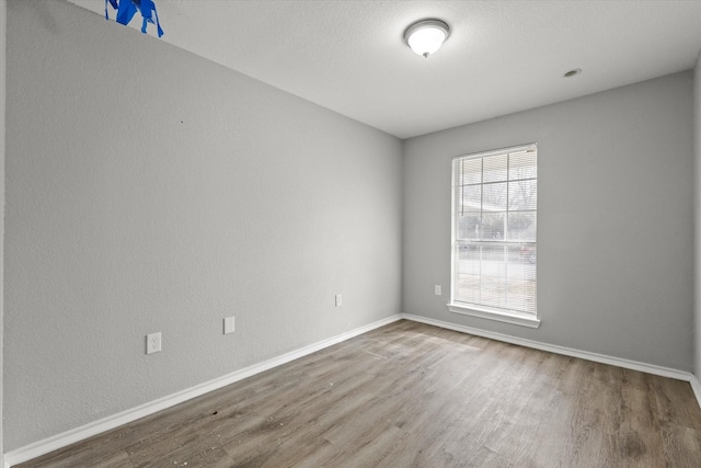 spare room featuring hardwood / wood-style floors