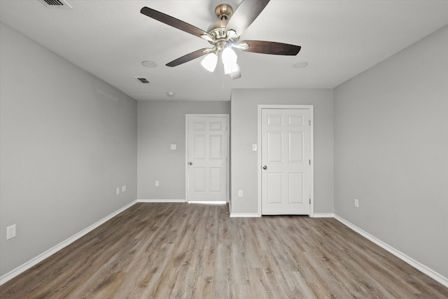 unfurnished bedroom featuring ceiling fan and light hardwood / wood-style floors