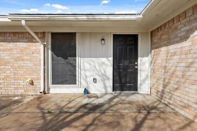 property entrance with a patio