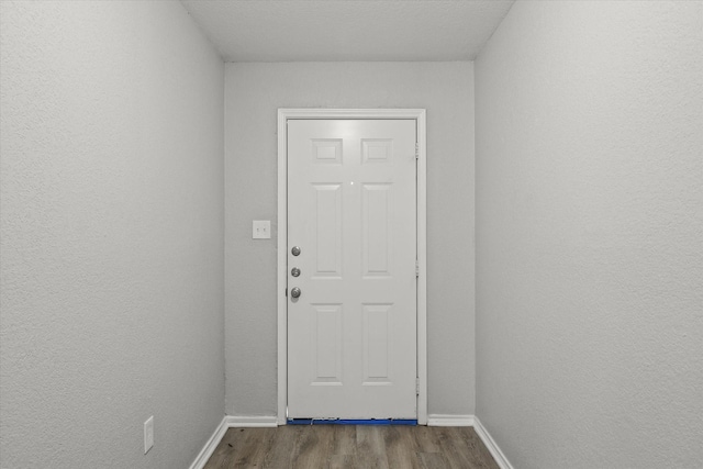 doorway to outside with hardwood / wood-style flooring