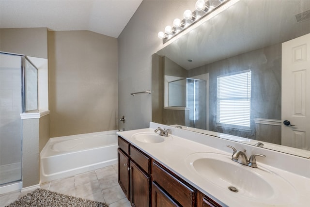 bathroom featuring shower with separate bathtub, lofted ceiling, tile patterned floors, and vanity