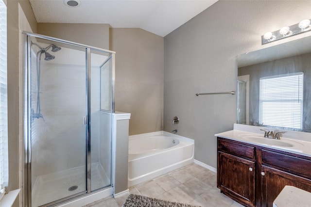 bathroom with vaulted ceiling, vanity, shower with separate bathtub, and tile patterned flooring