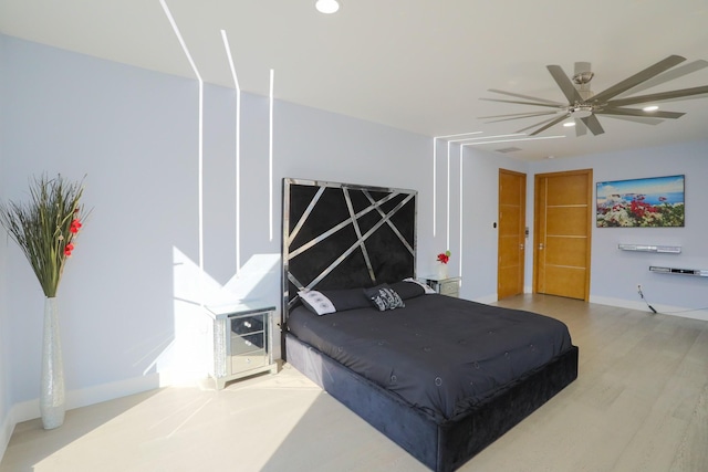 bedroom featuring ceiling fan and light hardwood / wood-style flooring