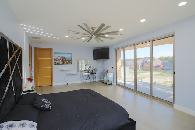 unfurnished bedroom with ceiling fan and access to exterior