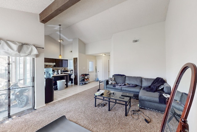 tiled living room featuring high vaulted ceiling