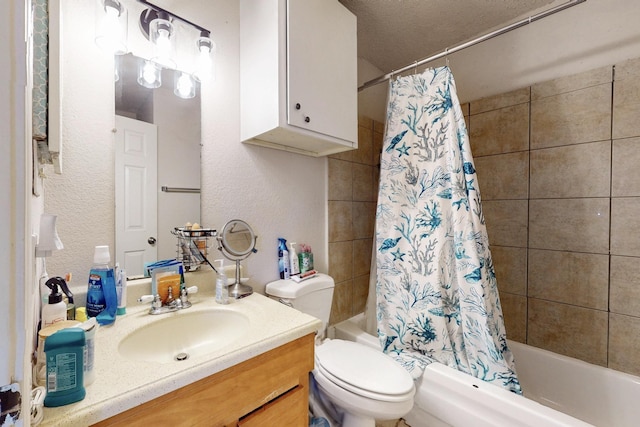 full bathroom featuring vanity, shower / bathtub combination with curtain, and toilet