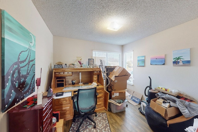 office space with hardwood / wood-style flooring and a textured ceiling