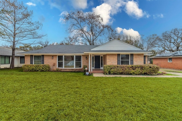 single story home with a front lawn and brick siding