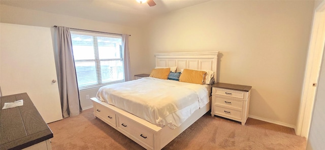 bedroom with lofted ceiling, baseboards, a ceiling fan, and light colored carpet