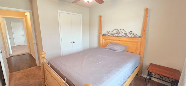 carpeted bedroom with ceiling fan and a closet