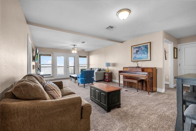 living room featuring light colored carpet and ceiling fan