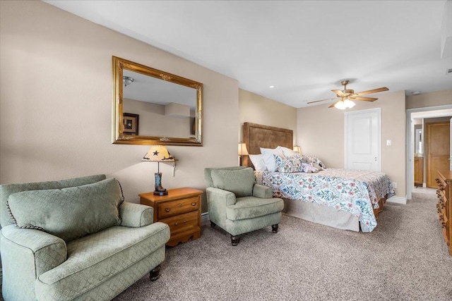 bedroom featuring ceiling fan and carpet