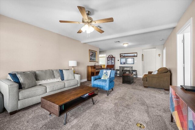 carpeted living room with ceiling fan