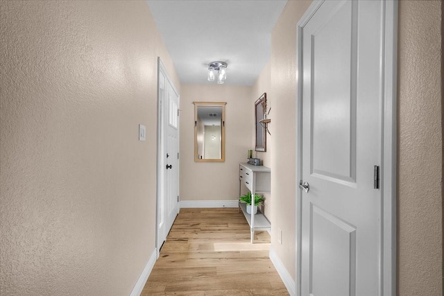 hallway featuring light hardwood / wood-style flooring