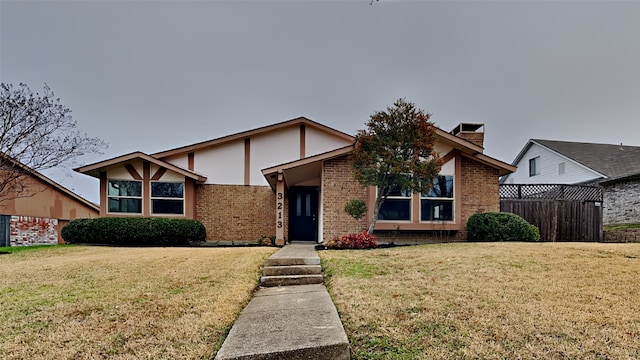 view of front of home with a front lawn