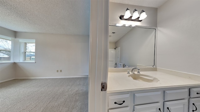 bathroom featuring vanity and a textured ceiling