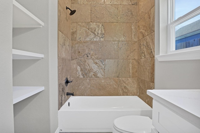 bathroom with toilet, vanity, and  shower combination