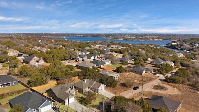 drone / aerial view with a residential view and a water view