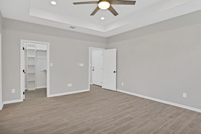 bathroom featuring vanity, hardwood / wood-style floors, and toilet