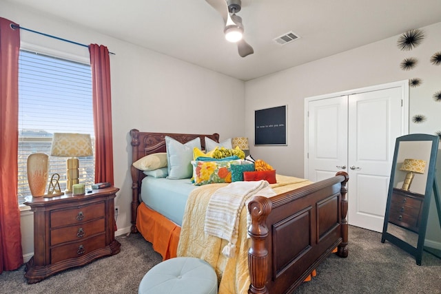 carpeted bedroom with a closet and ceiling fan