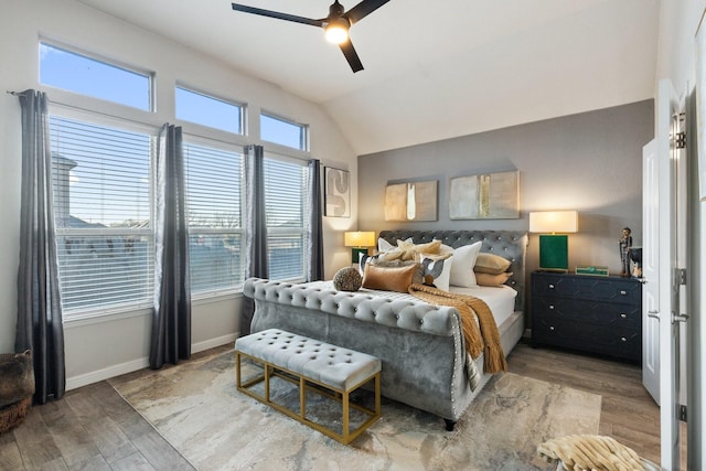 bedroom featuring vaulted ceiling, ceiling fan, and hardwood / wood-style floors