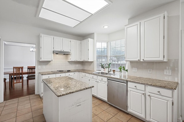 kitchen with sink, white cabinetry, a center island, light tile patterned floors, and dishwasher