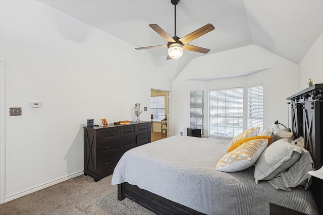 bedroom with ceiling fan, light colored carpet, and lofted ceiling